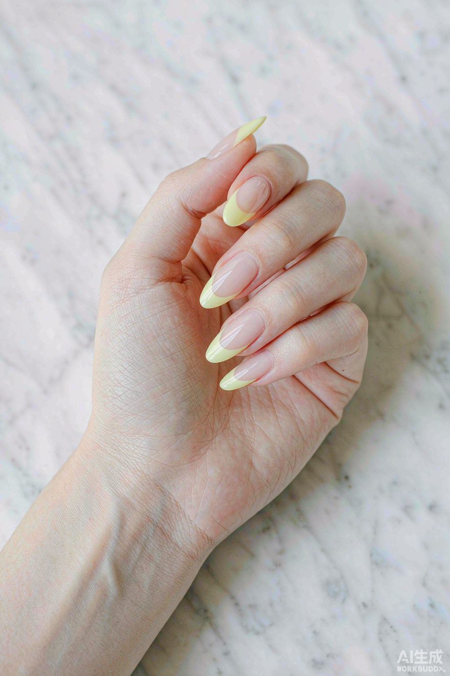 Almond nails with butter yellow French tips over glossy clear base